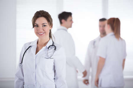 Portrait Of Young Smiling Professional Female Doctor With Stethoscopeの写真素材