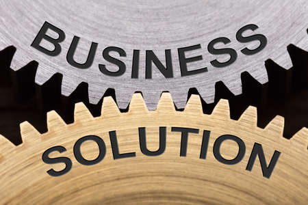 Closeup of business solution concept on interlocked cogwheelsの写真素材