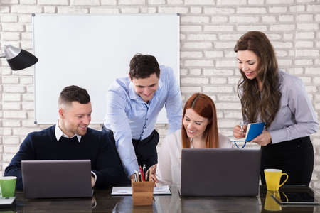 Business People At The Meeting Discuss Current Issues At The Modern Office