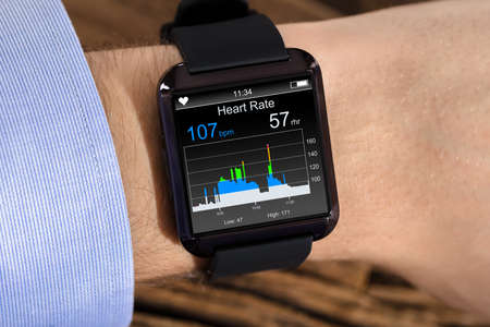 Person Hand Wearing Smart Watch Showing Heartbeat Rate