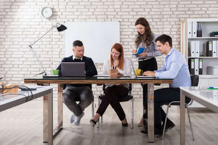 Business People At The Meeting Discuss Current Issues At The Modern Office