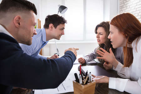 Business Coworker Arguing To Each Other At Workplace In Officeの写真素材