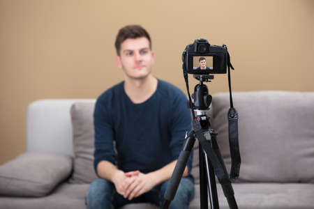 Close-up Of A Male Blogger Recording Video With Cameraの写真素材