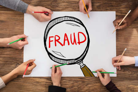 People Drawing Fraud Investigation And Audit Concept In Notepadの写真素材