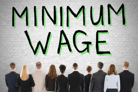 Group Of People Looking At Minimum Wage And Social Securityの写真素材
