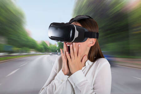 Close-up Of A Scared Young Woman Wearing Virtual Reality Glasses