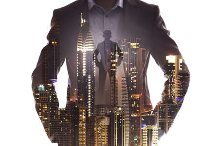 Double Exposure Of Businessman Superhero With Red Cape Dominates The City At Sunsetの写真素材