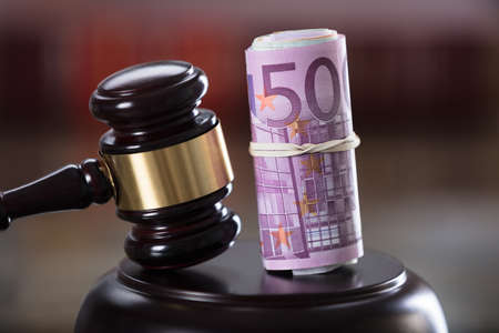 Close-up Of Gavel And Banknote In Courtroomの写真素材