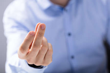Close-up Of A Man's Hand Snapping His Fingerの写真素材