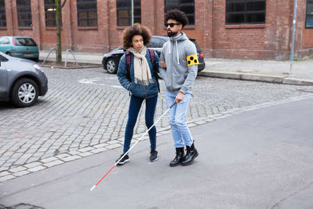 Close-up Of A Thief's Hand Stealing Purse From Backpackの写真素材