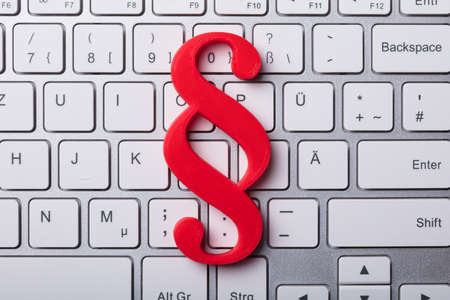 Elevated View Of Red Paragraph Symbol On Laptop Keypadの写真素材