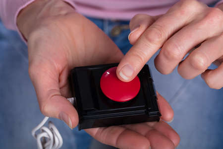 Close-up Of Woman Holding Personal Alarm On Her Hands