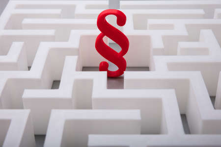 Elevated View Of Red Paragraph Symbol In The Centre Of White Mazeの写真素材