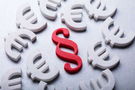 High Angle View Of Red Paragraph Symbol Surrounded By Euro Currency Signsの写真素材