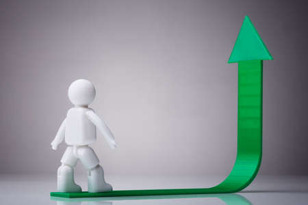 Human Figure Walking On Green Arrow Pointing Upward