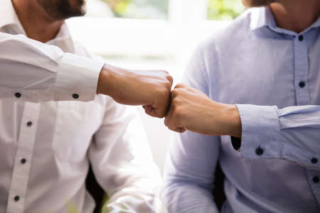 Close-up Of Two Business Partners Making Fist Bumpの写真素材