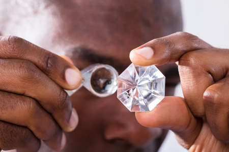 Close-up Of A Person Checking Quality Of Diamondの写真素材
