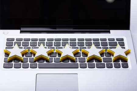 Close-up Of Five Star Rating Icon On Laptop Keypadの写真素材