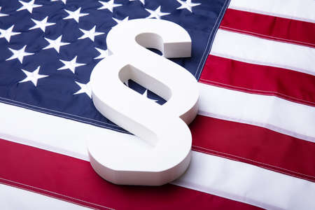 Close-up Of White Paragraph Symbol On American Flag