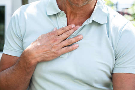 Midsection View Of A Man Having Acid Reflux Painの写真素材