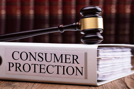 Judge Gavel On Consumer Protection Folder With Stack Of Papersの写真素材