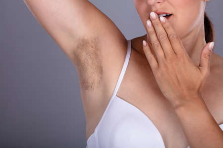 Close-up Of A Young Woman With Hairy Armpit