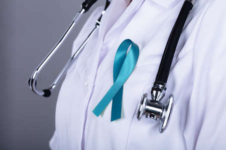 Doctor With Teal Ribbon Supporting Ovarian Cancer Awarenessの写真素材