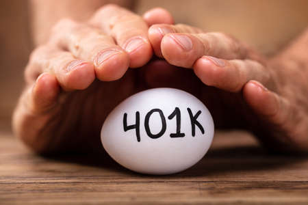 Close-up Of A Man's Hand Protecting 401k White Eggの写真素材