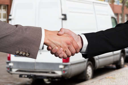 Close-up Of Two Business Partners Shaking Hands At Outdoorsの写真素材