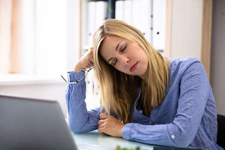 Photo Of Beautiful Young Businesswoman Sleeping In Office