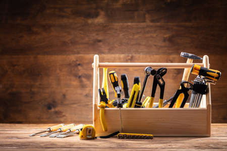 Toolbox With Various Worktools On Wooden Surfaceの写真素材