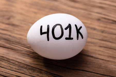 Close-up Of 401k White Egg On Wooden Backgroundの写真素材