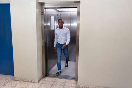 Young African Man Coming Out From An Elevator
