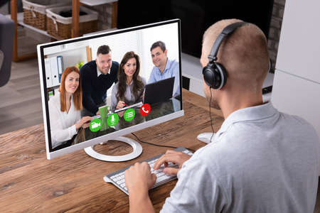 Businessman Video Conferencing With His Colleagues On Computer
