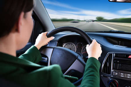 Close-up Of A Woman Traveling By Carの写真素材