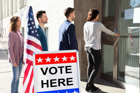 Group Of Young People Standing At The Entrance Of Voting Roomの写真素材