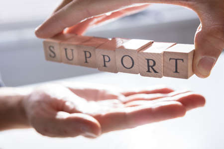 Close-up Of Person's Hand Giving Support To Other Person