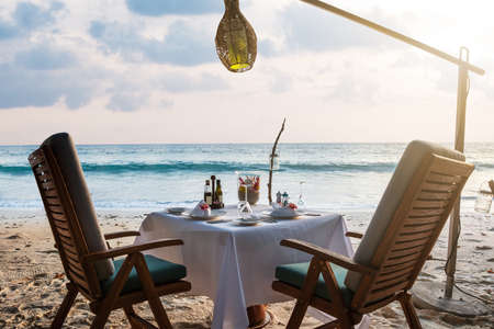 Close-up Of Dinner Table Under The Tree On The Seaside At Beach