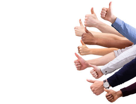 Close-up Of People's Hand Showing Thumb Up Sign Against Isolated On White  Background