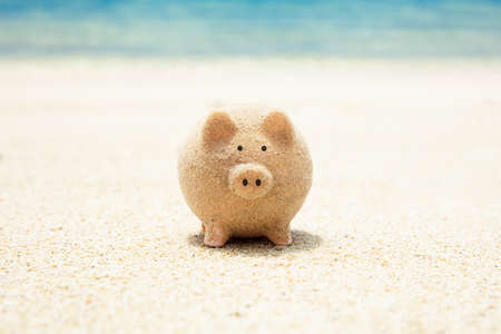 Close-up Of Piggybank Made Out Of Sand On Beachの写真素材