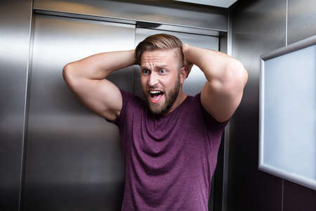 Man Suffering From Claustrophobia Trapped Inside Elevator Screaming