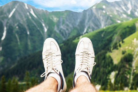 Man Flying In The Mountains Through Skyの写真素材