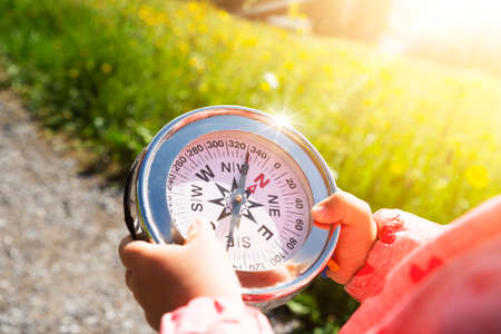 Girl Playing Geocaching Game In Mountains In Summerの写真素材