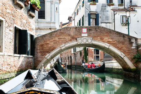 Small Bridge Connecting The Old Houses Along The Canalの写真素材