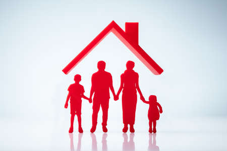 House Roof Above Family Figures Silhouette Over White Backgroundの写真素材