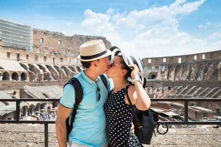 Young Tourist Couple Kissing In Inside Of Colosseum In Rome, Italyの写真素材