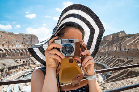 Woman Taking Photo Inside Of Colosseum In Rome, Italy