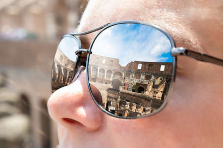 Colosseum In Rome Reflecting In Woman's Sunglassesの写真素材