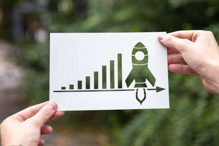 Hands Holding Paper With Cutout Growth Chart Outdoorsの写真素材