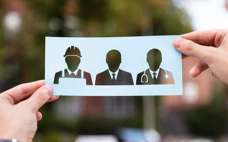 Hands Holding Paper With Cutout Career Choice Outdoorsの写真素材
